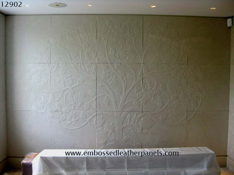 Embossed tree design panels covering the whole wall
